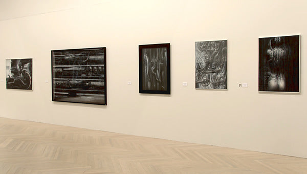 Black and white paintings on yellow.